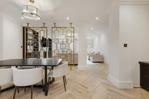 Dining room with decorative divider and living room - Buy this luxury property in London, 3 bedrooms