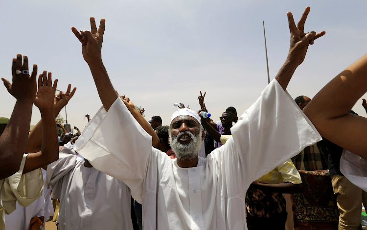 A Sudanese demonstrator chants slogans as he protests against the army's announcement that President Omar al-Bashir would be replaced by a military-led transitional council, near Defence Ministry in Khartoum, Sudan, on April 12, 2019