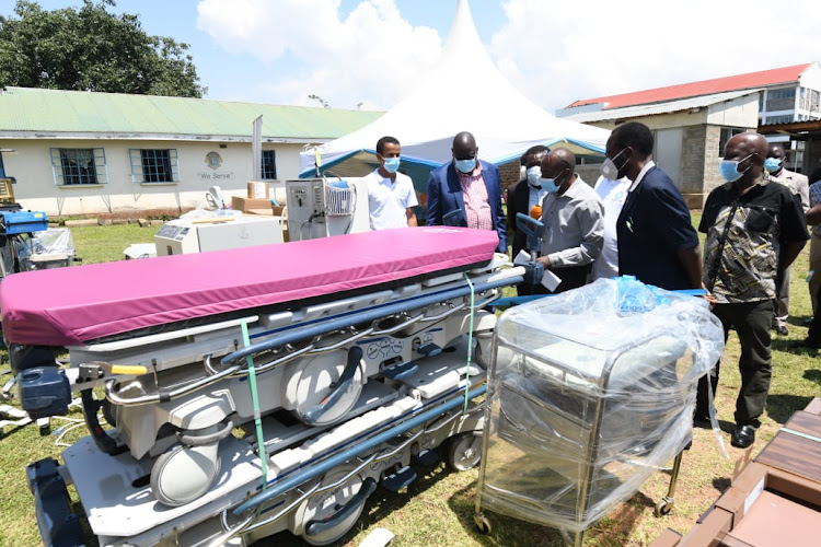 Kisumu Governor Anyang' Nyong’o and Deputy Governor Mathews inspect medical equipment and supplies donated by Helping Hand For Relief and Development to the county