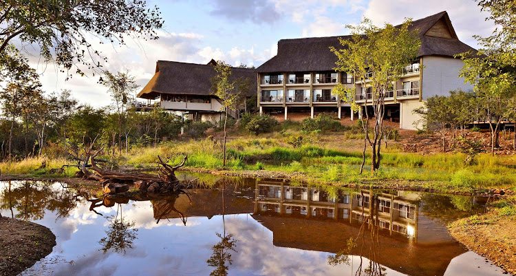 View of Victoria Falls Safari Club from its waterhole.