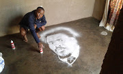 Percy Maimela with one of his salt paintings.