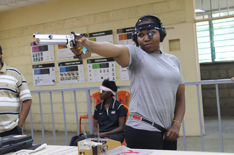 Marianne Cherotich aims at her target during the Mars Mechanical Engineers shoot at the Sailing Club shooting range on March 17.