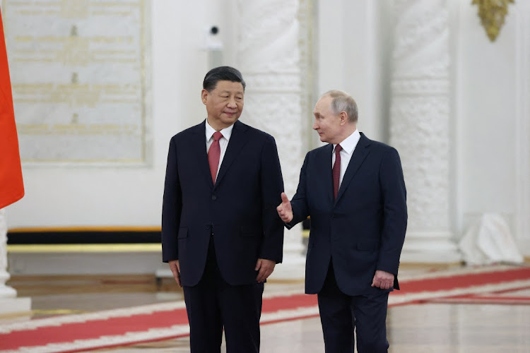 Russian President Vladimir Putin, right, and Chinese President Xi Jinping attend a ceremony at the Kremlin in Moscow, Russia, March 21 2023. Picture: SPUTNIK/REUTERS