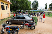 Relatives of worshippers who were attacked by gunmen during a Sunday mass service gather at the Federal Medical Centre in Owo, Ondo, Nigeria, June 6, 2022.