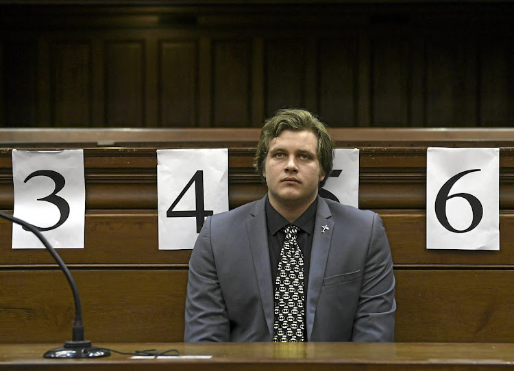 EXPRESSIONLESS Murder-accused Henri van Breda listens to blood splatter expert Captain Marius Joubert giving evidence at his trial in the Cape Town High Court.