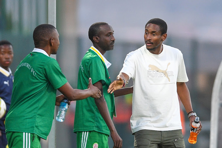 Mamelodi Sundowns coach Rulani Mokwena shakes hands with Bumamuru coach Vivier Bahati after their Caf Champions League second preliminary round at Lucas Moripe Stadium on Saturday.