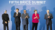 PATS ON THE BACK: India's former prime minister, Manmohan Singh, China's Xi Jinping, Jacob Zuma, Brazil's Dilma Rousseff and Russia's Vladimir Putin at the Brics summit in Durban in 2013.