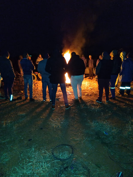 Men from Ext 22 in Protea Glen, Soweto braved cold winter nights to physically guard their electricity power box.