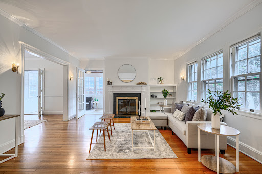 Bright living room with fireplace and sofa in this luxury house for sale in Baltimore ($635,900)