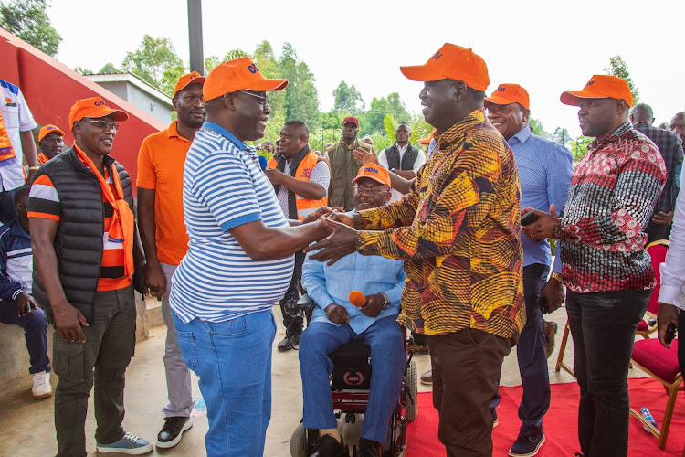 Azimio leader Raila Odinga receives National Assembly Speaker Moses Wetang’ula's younger brother Fred Wetang’ula to the Orange Democratic Movement on January 17, 2023.