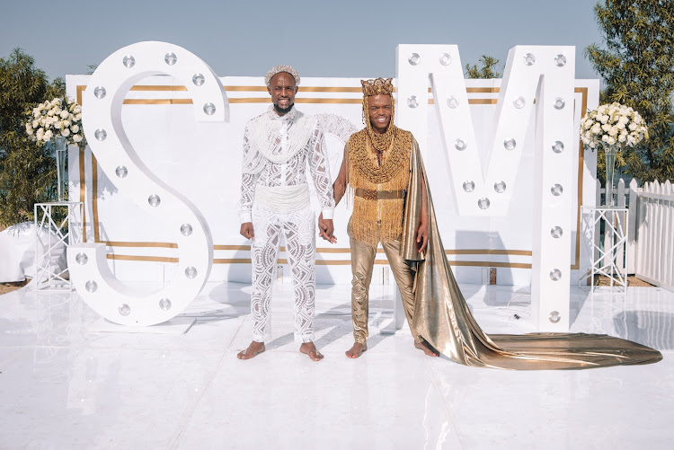 Grooms Mohale Motaung and Somizi Mhlongo in the Egyptian-inspired looks designer Gert-Johan Coetzee created for their traditional wedding in September 2019.