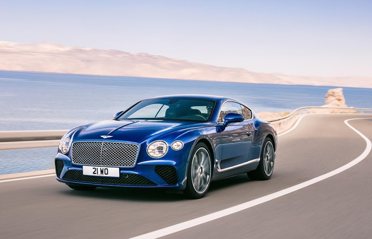 The Bentley Rotating Display features the infotainment screen, clean wood or these three dials