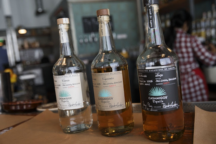 Bottles of Casamigos blanco, reposado, and anejo tequilas at a restaurant in Los Angeles, California, the US. Picture: PATRICK T FALLON/BLOOMBERG