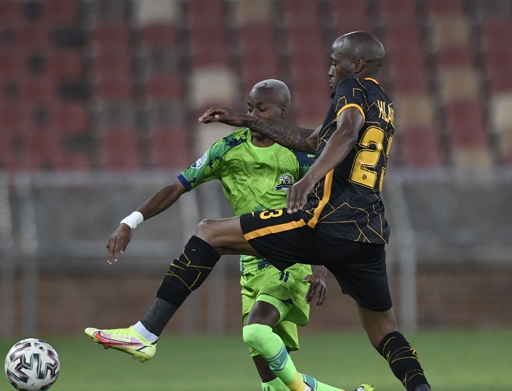 Sifiso Hlanti of Kaizer Chiefs challenges Katlego Otladisa of Marumo Gallants in the DStv Premiership match at Peter Mokaba Stadium in Polokwane on September 26 2021.