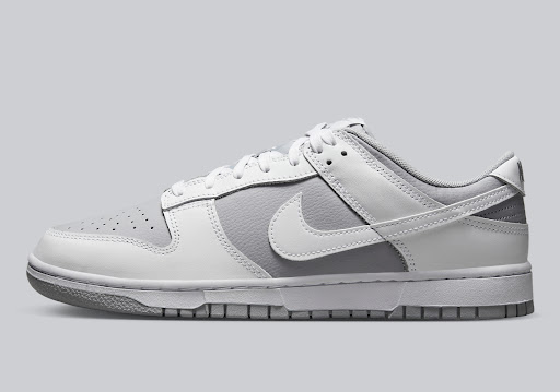 The Nike Dunk Low Appears In A Grey And White Color Combination
