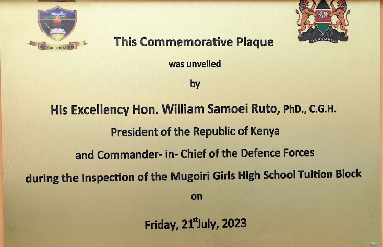 President William Ruto unveils a commemorative plaque at Mugoiri Girls High School in Murang'a on July 21, 2023.