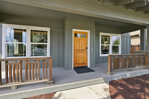House facade with wooden porch in this luxury house for sale in Bend ($529,900 - 154 m²)