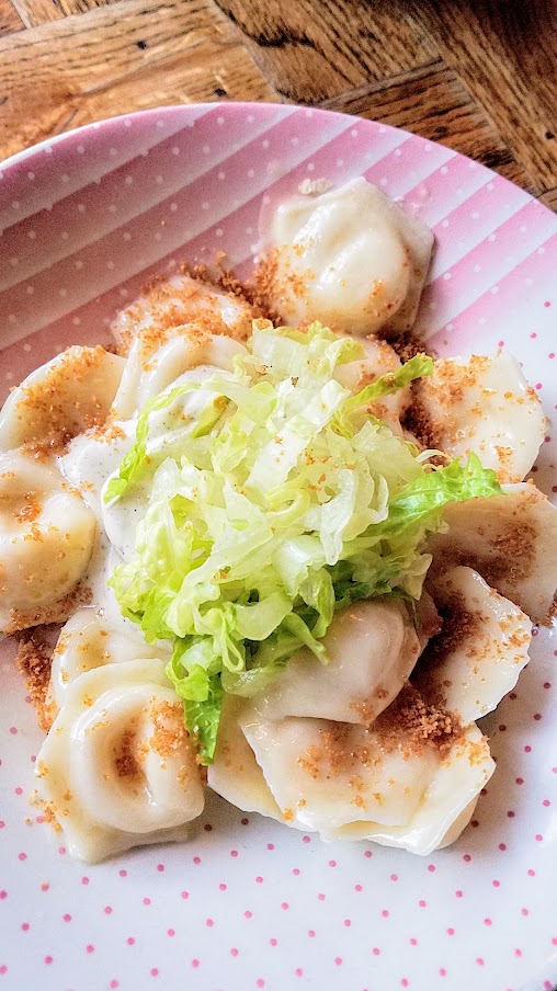 Portland Dumpling Week 2019 dish from Kachinka of Parmesan vareniki with Caesar smetana, shredded romaine and toasted breadcrumbs