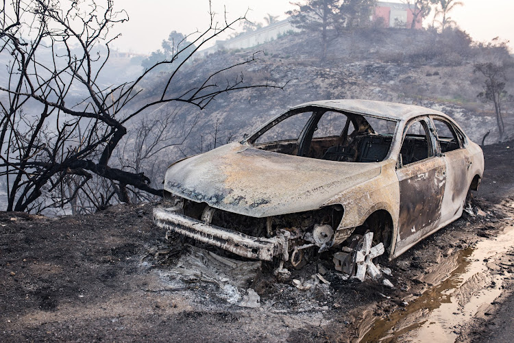 Remains of a burnt car after the Woolsey Fire swept through. The Woolsey fire has already burned more than 70,000 acres as it continues to grow while reaching the Pacific Coast at Malibu.