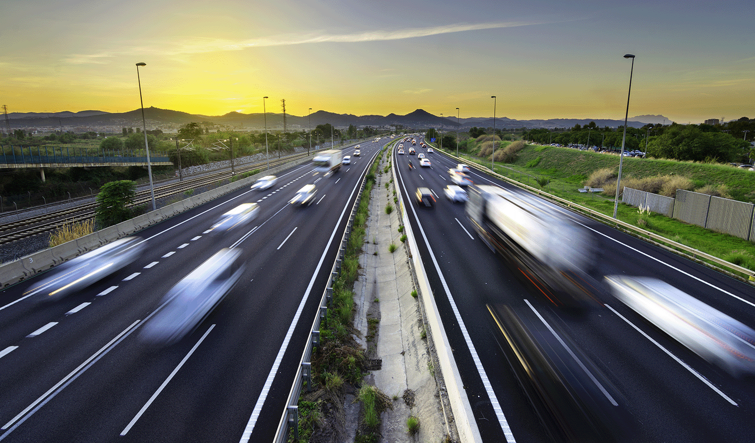 A busy highway with many cars 
