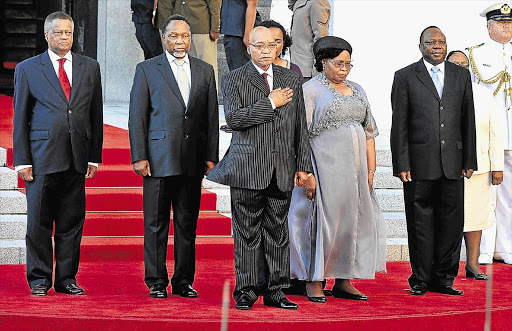 Speaker in the National Assembly Max Sisulu, Deputy President Kgalema Motlanthe, President Jacob Zuma, his wife Sizakhele Makhumalo Zuma and chairman of the National Council of Provinces Mninwa Mahlangu watch the defence force parade outside parliament.