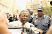 I'M INNOCENT: Former police chief Jackie Selebi outside the Johannesburg high court yesterday where he appeared on charges of corruption and defeating the ends of justice. Pic: PETER MOGAKI. 05/10/2009. © Sowetan.