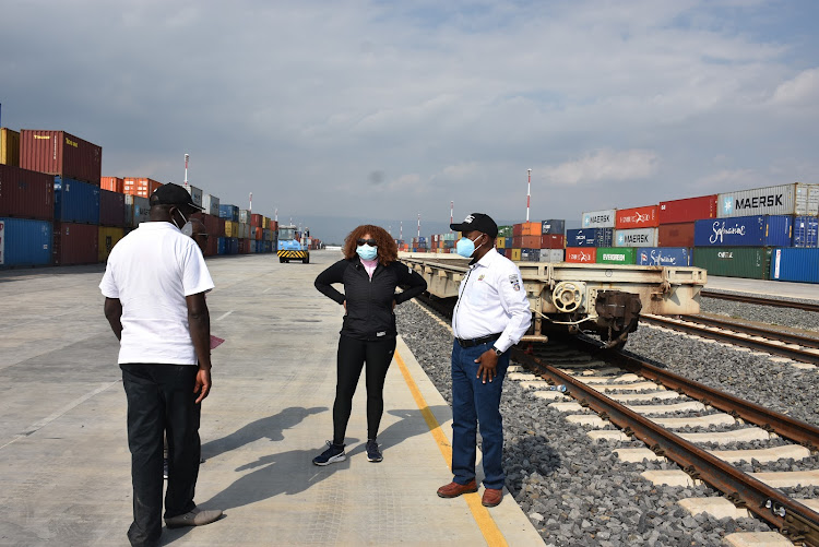 WRC Safari Rally CEO Phineas Kimathi (right) with organising committee member Rose Wachuka during a tour of the Inland Container Depot in Naivasha last weekend.