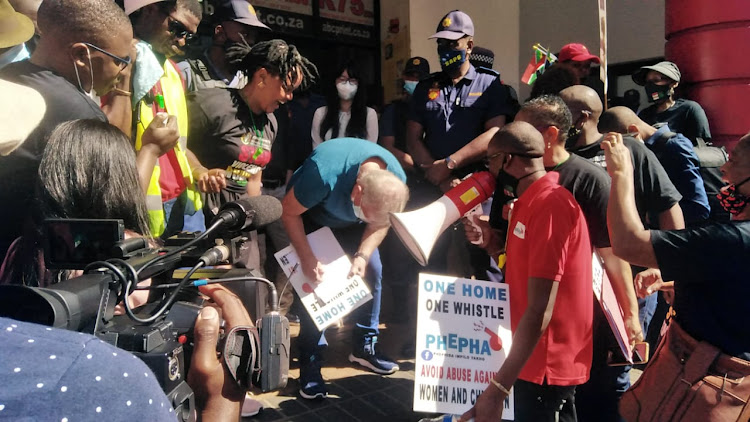 George Mystris signing a memorandum outside the China Mall in Durban on Monday after an anti-gender based violence group raised concerns over alleged sex abuse claims.