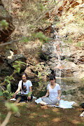 A breathwork session at the waterfall. 