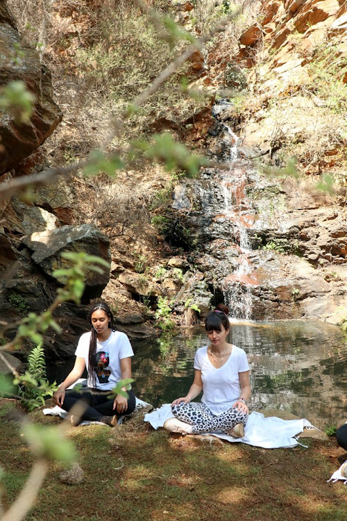 A breathwork session at the waterfall.