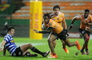 Sibahle Maxwane of the Free State Cheetahs goes past Ruhan Nel of Western Province during the Currie Cup game at the Newlands Rugby Stadium in Cape Town on August 25, 2018. 
