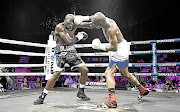 Nkululeko Mhlongo jolts the head of Walter Dlamini en route to a fourth-round stoppage in their previous fight in the Sun Arena in Pretoria. 