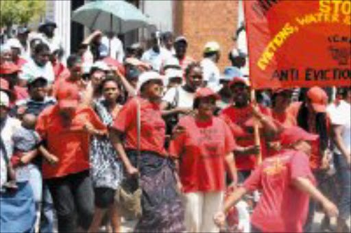 RELIEVED: Inner city residents celebrate their constitutional court victory yesterday. Pic. Mbuzeni Zulu. 19.02/08. © Sowetan.