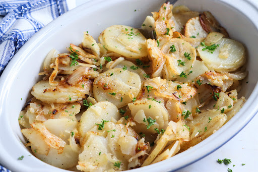 Olive Oil Stir-Fry Potatoes and Onions in a serving dish.