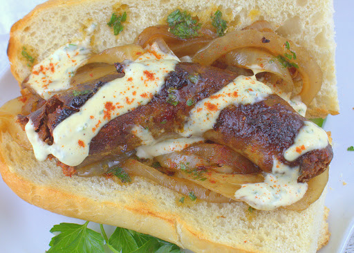 Argentine Choripan with Sauteed Onions and Chimichurri Aioli