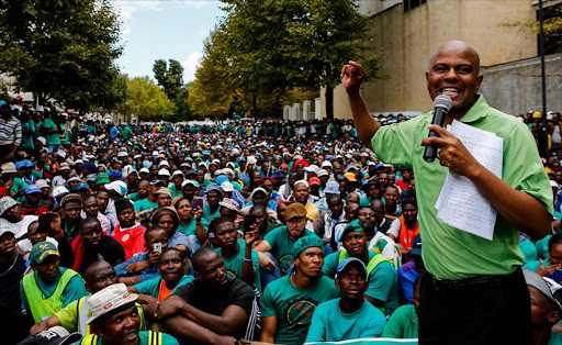 FILE PICTURE: March 27, 2014. AMCU president Joseph Mathunjwa addressing AMCU member outside the Impala Platinum's offices on Fricker Road in Illovo to hand over a memorandum. AMCU strike started two months ago, demanding a R12 500 basic monthly salary while Anglo American, Lonmin and Impala platinum mines are offering 7.5%. Pic: Moeletsi Mabe. © The Times