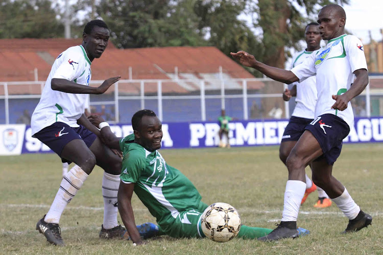 Thika United's Christopher Oruchum (L) and teammate Said Tsuma challenge Gor Mahia's Timothy Otieno during a past KPL match