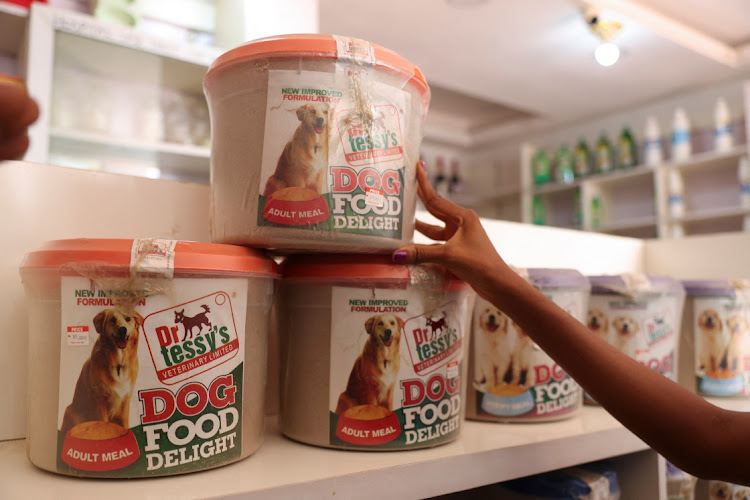A customer checks the price of dog food in Ibadan, Oyo state, on May 26 2025.