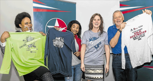 ALL DRESSED UP: From left, Noxolo Sojolo (Overtakers Athletic Club), Lwandlekazi Nkontso (Overtakers Athletic Club), Roxanne Lands and Gerald Berlyn (Air Conditioning Services, a previous sponsor of the race) with various Sole Destroyer shirts. Lands wears this year’s 25th year T-shirt