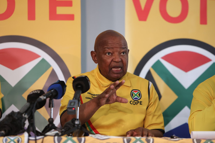 COPE president Mosiuoa Lekota talks to journalists during a press conference on August 31.