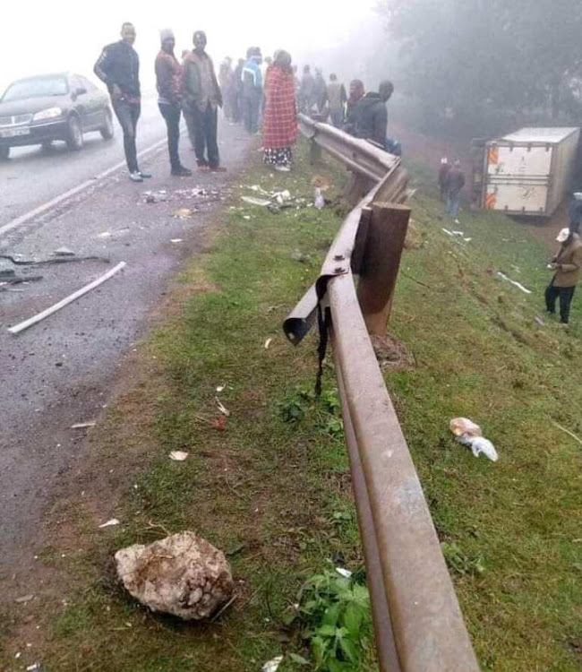 Residents of Njira ya Gitithia at the scene where an accident involving three vehicles occurred on Thursday.