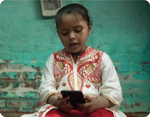 A young girl in Uttar Pradesh reads a story on Read Along as part of the daily reading activity in the state.