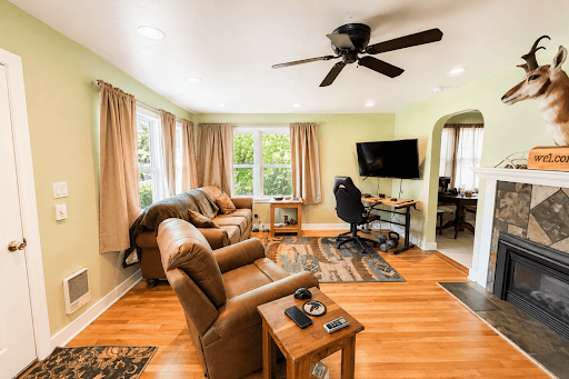 Living room with sofas, desk, fireplace - House purchase in Prineville, 2 bedrooms