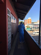 Forensic crime scene investigators outside a flat in Pretoria