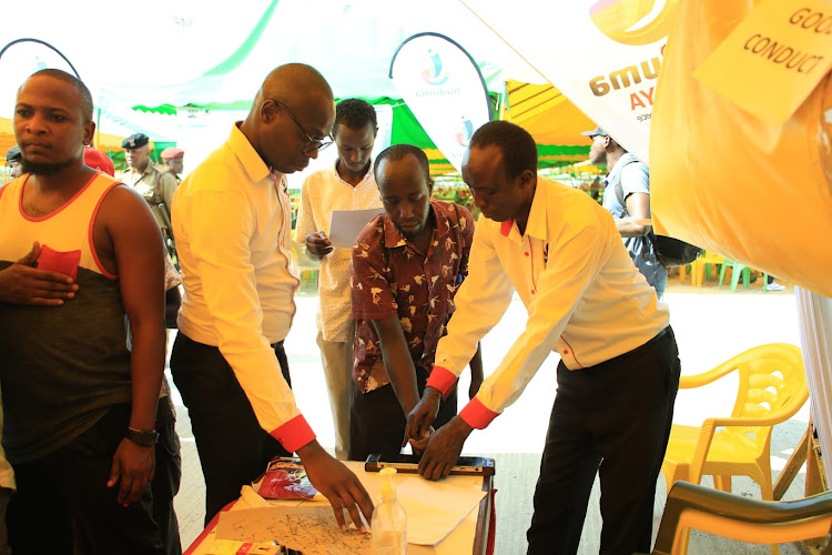 Huduma Centre Mombasa deputy manager Harrison Yogo, Fernando Kipchirchir and Benjamin Kurgat at Kibarani Miracle Park on Tuesday