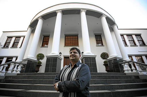 Atul Gupta at the bottom of the steps to his then Saxonwold, Johannesburg, home. File image