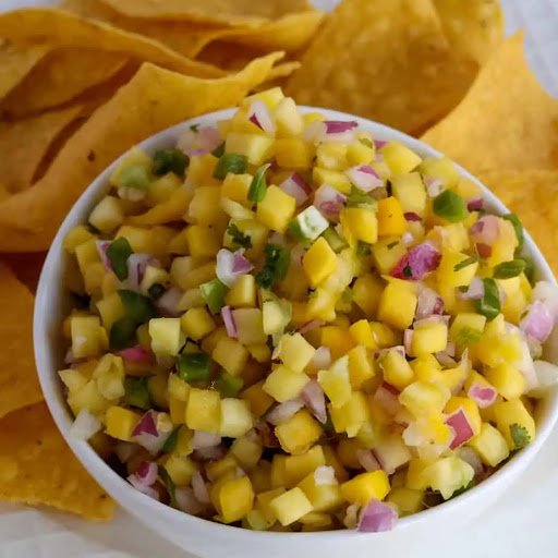 A bright and colorful delicious Mango Salsa made with eight easy ingredients in about ten minutes. 