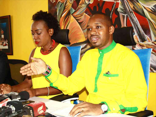 Starehe MP aspirant Boniface Mwangi with his deputy party leader Scheaffer Okore addressing media in Nairobi on March 20, 2017. /JOSEPH NDUNDA