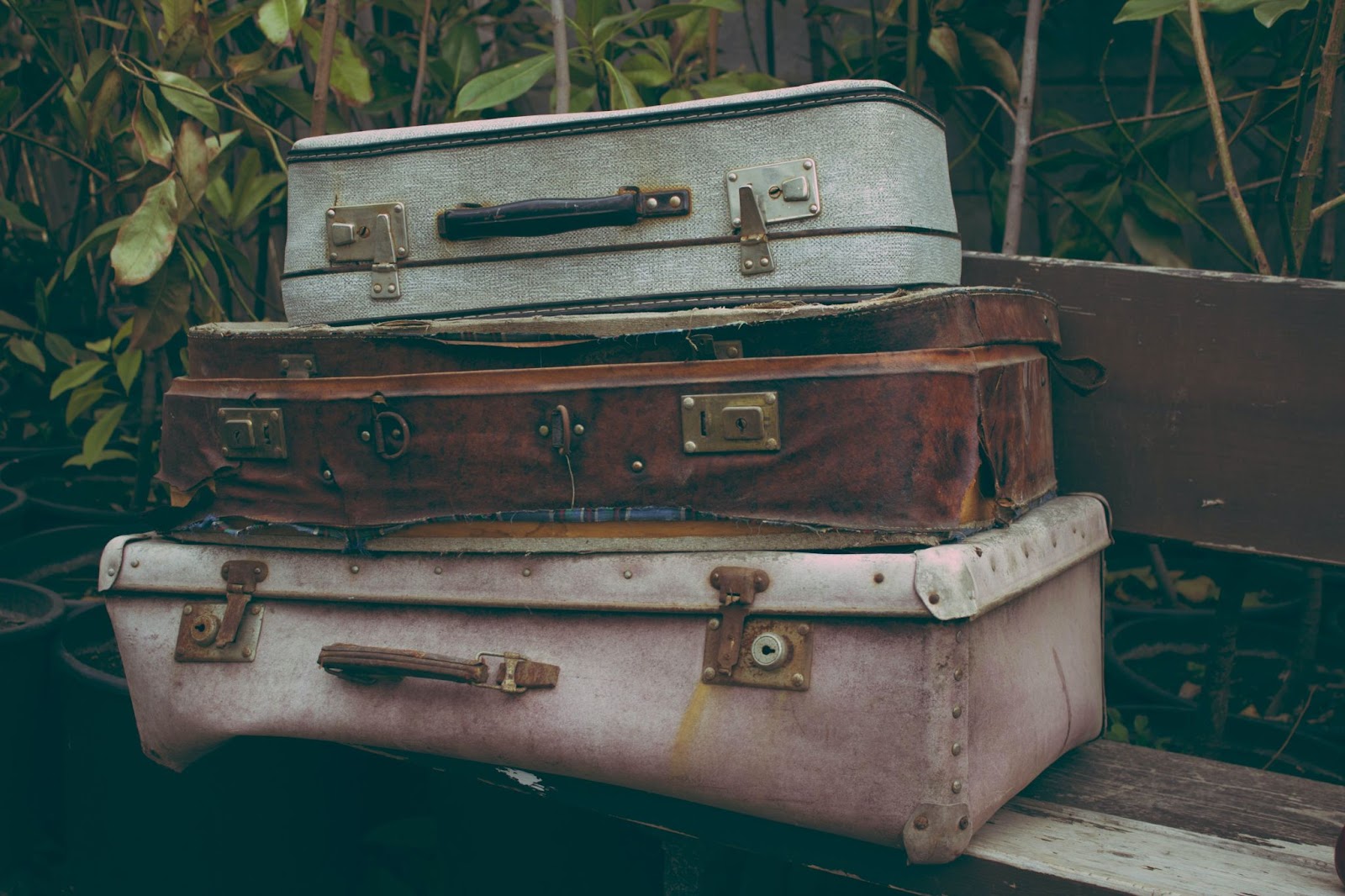 Three suitcases stacked on top of each other