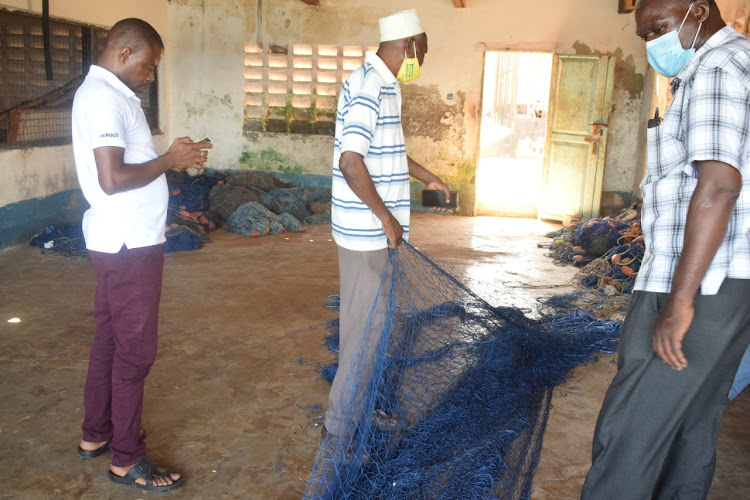 Local fishermen in Mombasa prepare a gillnet before going into the deep sea for fishing